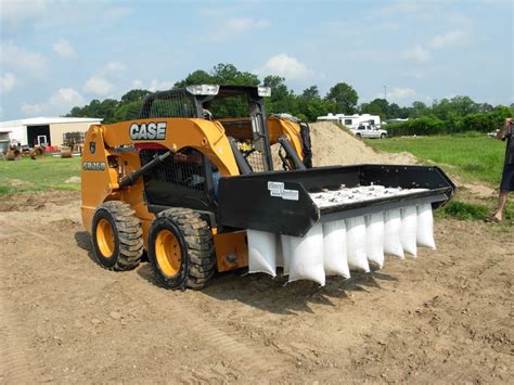 skid steer sand bag attachment|sandbagging machine skid steer.